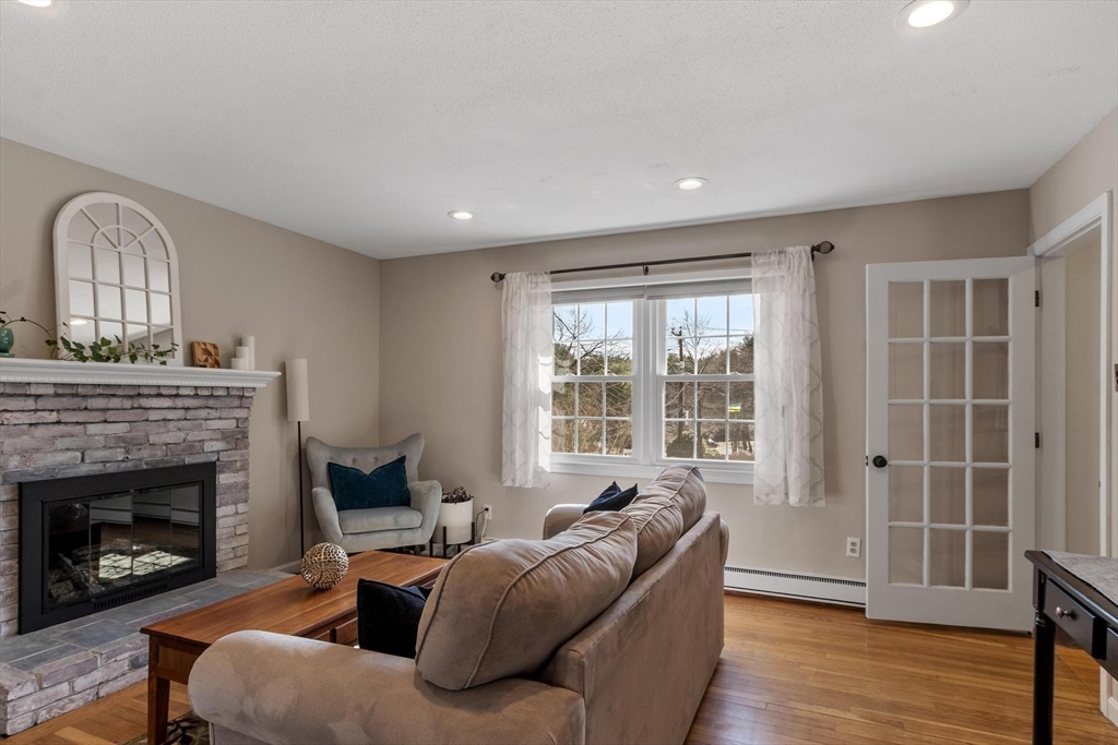 21 Potter Road Framingham, MA 01701 - Photo 4 of 42 a living room with furniture window and a fireplace