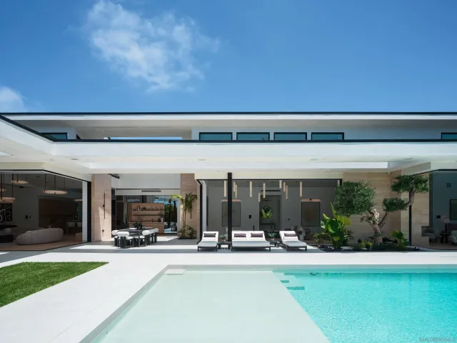 a view of an outside dining space with furniture