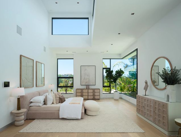 a bathroom with a toilet a sink and a mirror