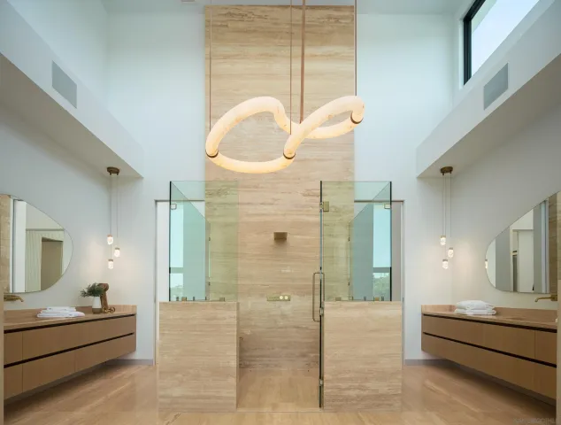 a kitchen with stainless steel appliances granite countertop a sink and a refrigerator