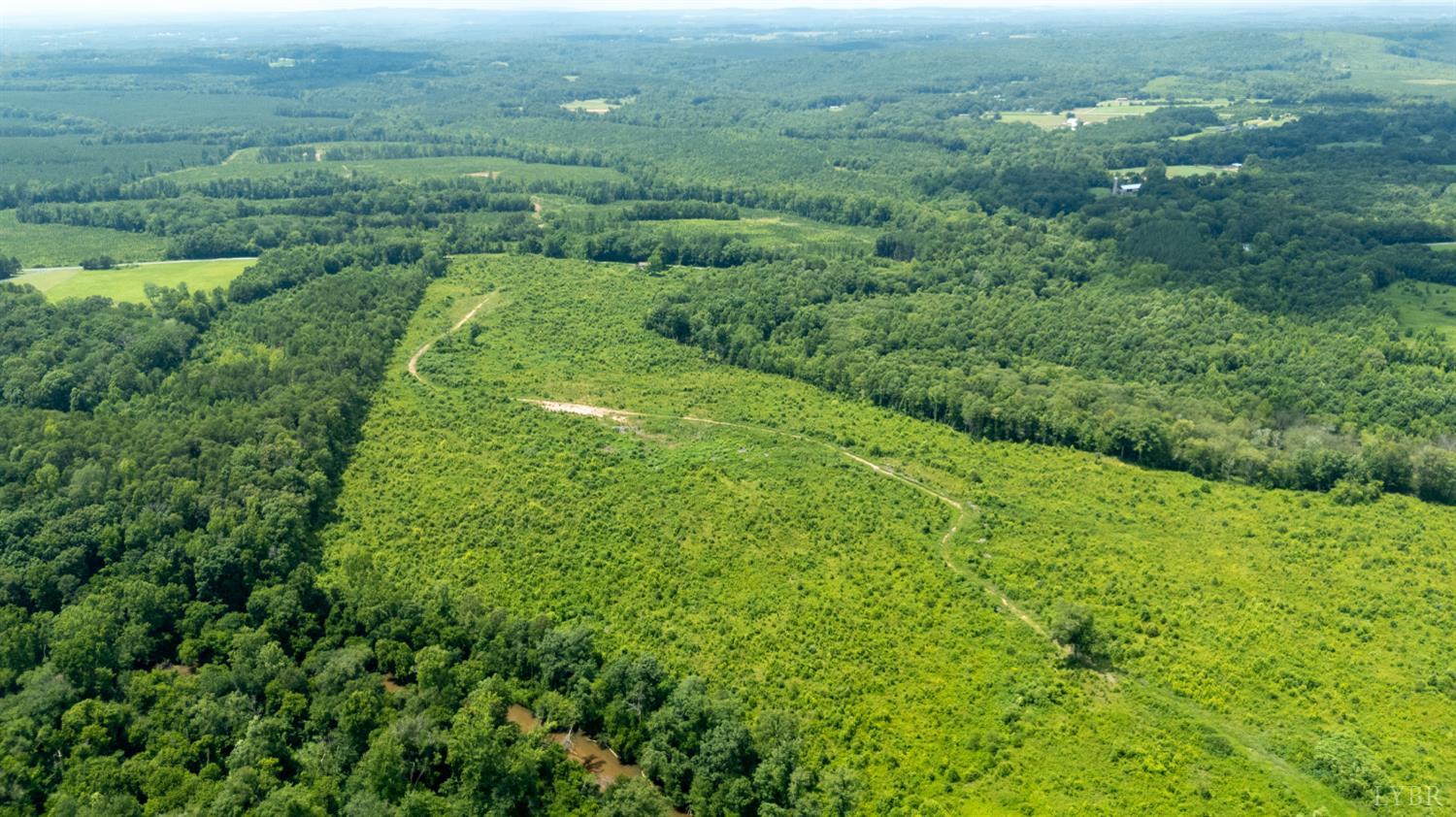 937 White Fall Road Gretna, VA 24557 - Photo 14 of 19 an aerial view of residential houses with outdoor space and trees