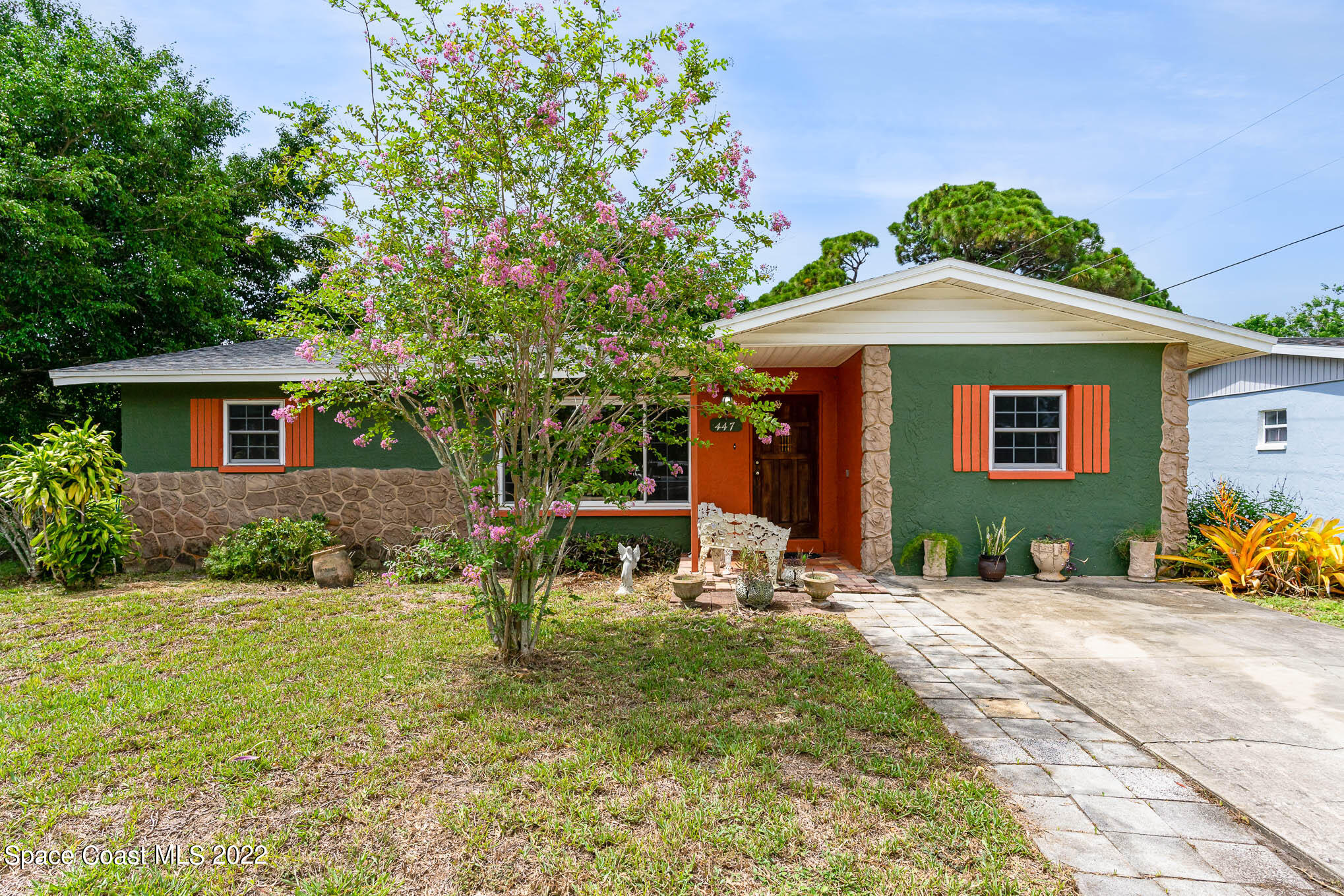 447 Count Street Melbourne, FL 32901 - Photo 1 of 24 a front view of a house with a yard