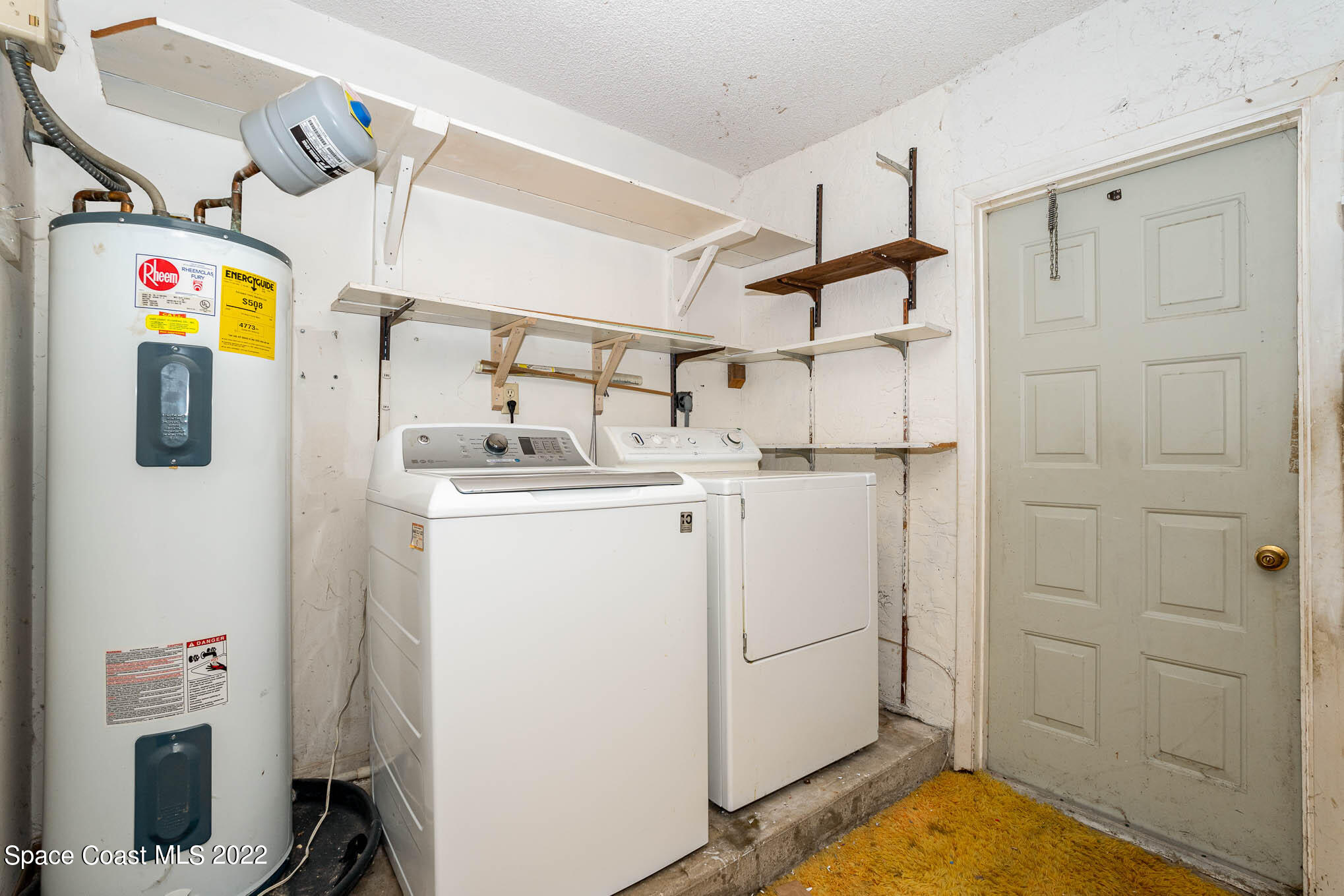 447 Count Street Melbourne, FL 32901 - Photo 23 of 24 a utility room with dryer and washer