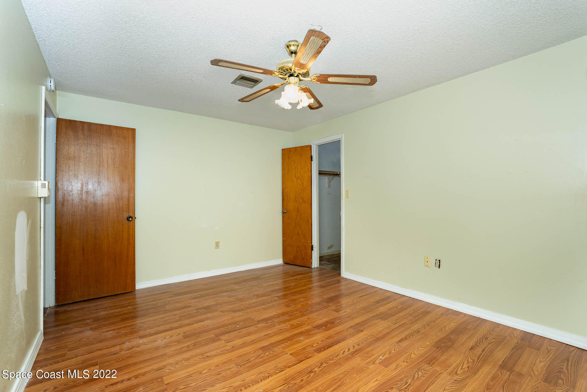 447 Count Street Melbourne, FL 32901 - Photo 10 of 24 a view of an empty room with wooden floor