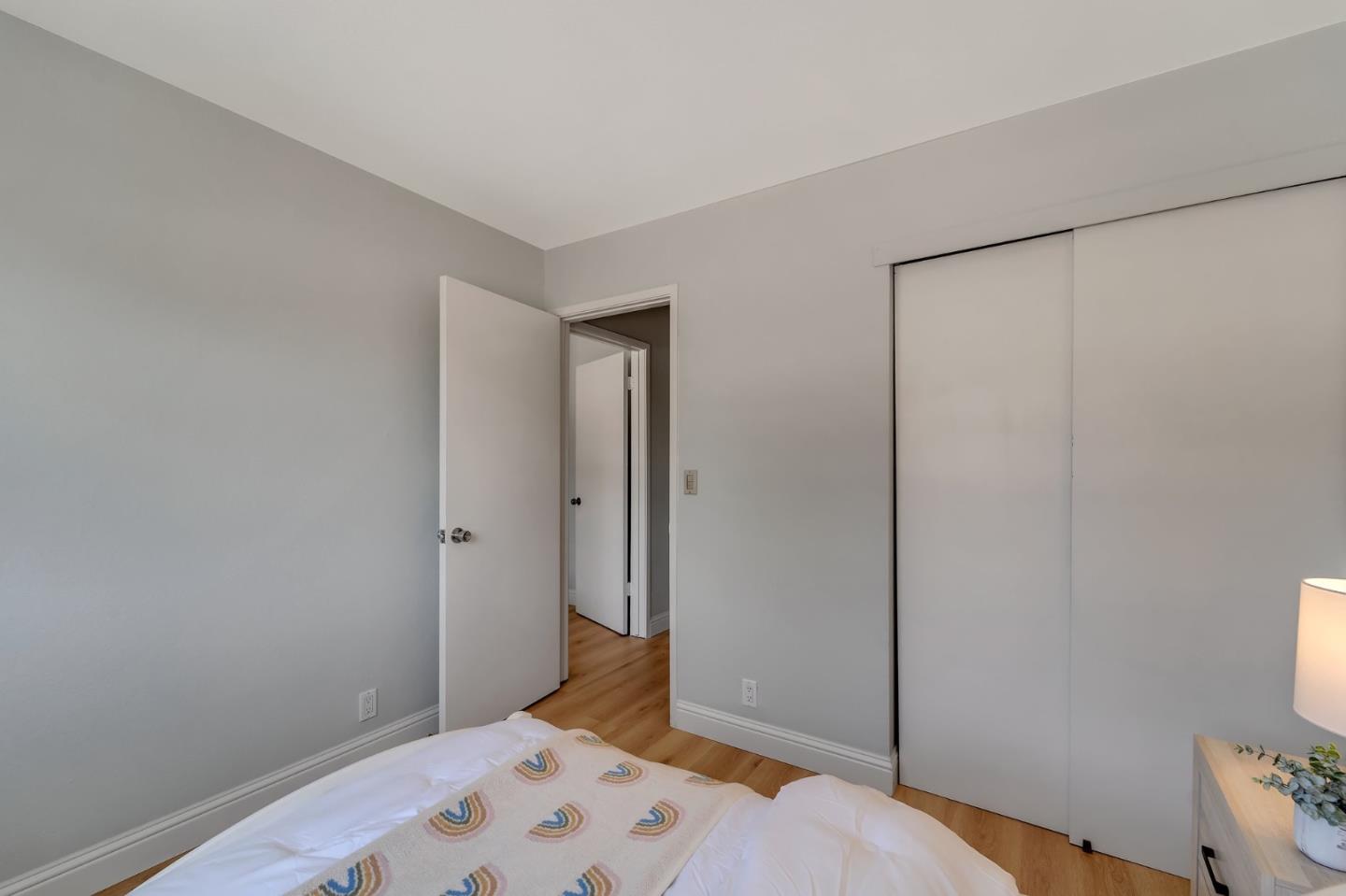 3424 Pisces Drive San Jose, CA 95111 - Photo 17 of 27 a bedroom with a bed and wooden floor
