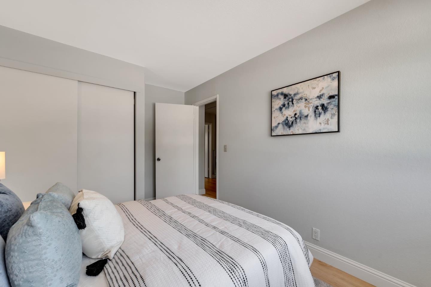 3424 Pisces Drive San Jose, CA 95111 - Photo 19 of 27 a bedroom with a bed and a wall painting