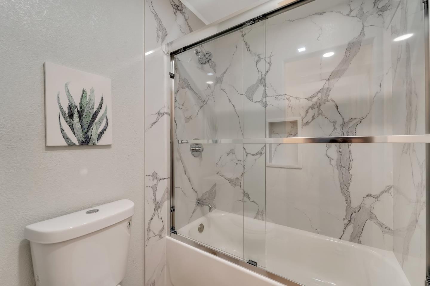 3424 Pisces Drive San Jose, CA 95111 - Photo 20 of 27 a bathroom with a bathtub and a shower