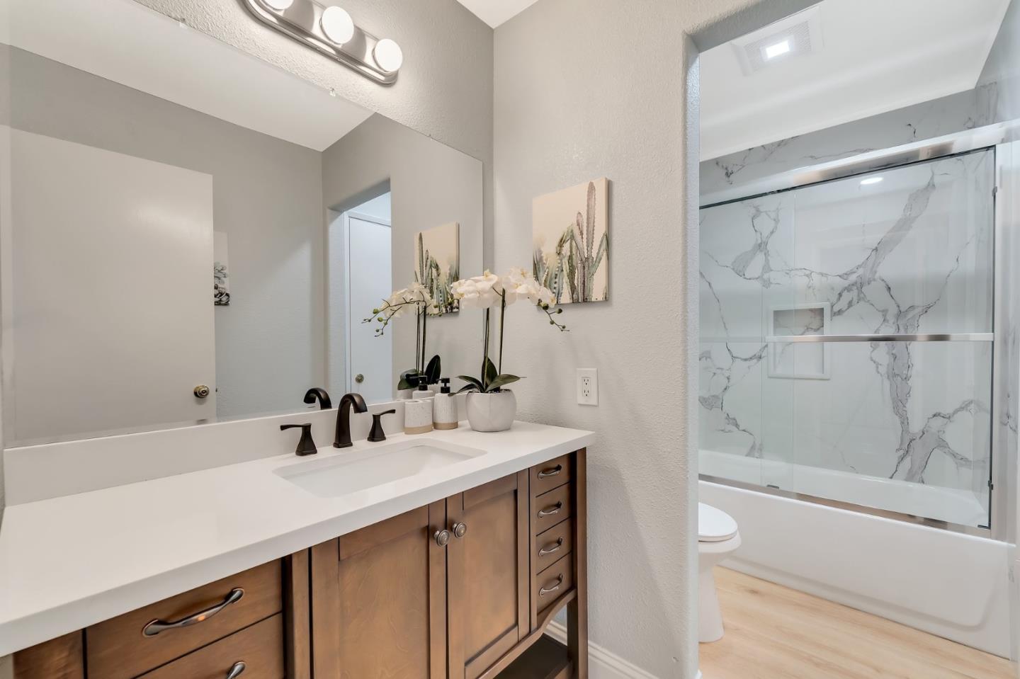 3424 Pisces Drive San Jose, CA 95111 - Photo 7 of 27 a bathroom with a double vanity sink mirror and shower