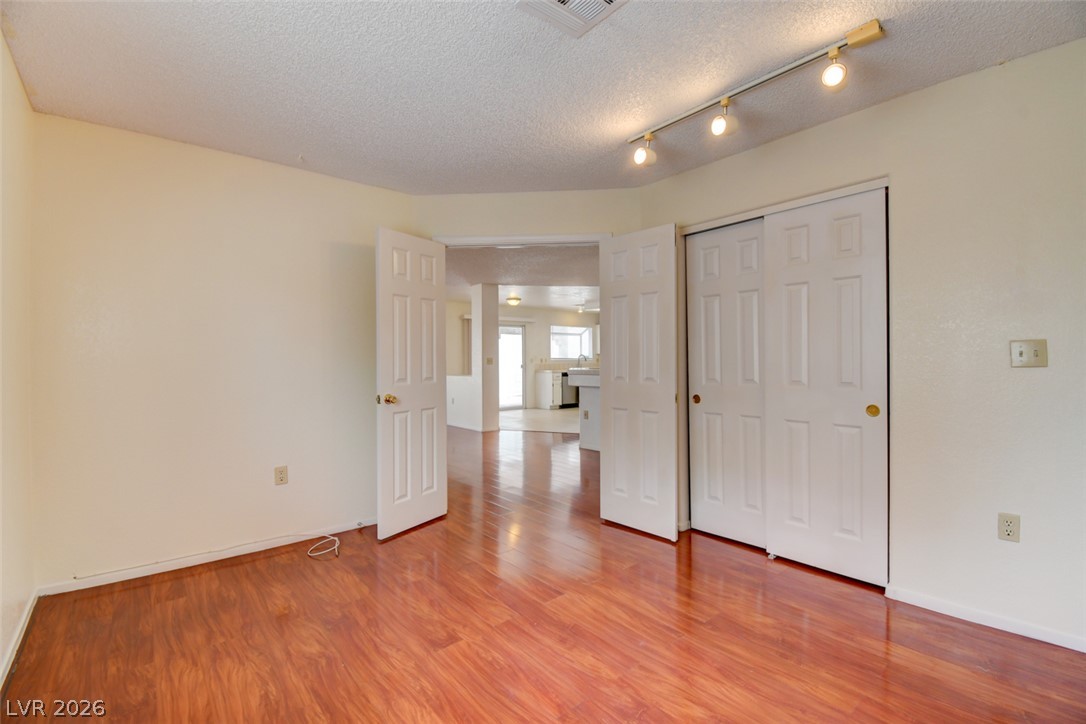 5 Tarryall Terrace Henderson, NV 89074 - Photo 14 of 44 Rich hardwood-style flooring creates a warm ambiance throughout this versatile living space.