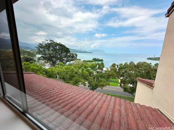a view of a balcony with wooden floor