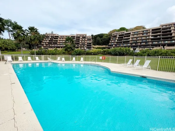 a view of a swimming pool with a lake