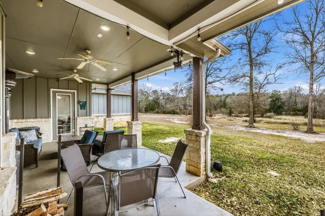 a view of a swimming pool with an outdoor seating