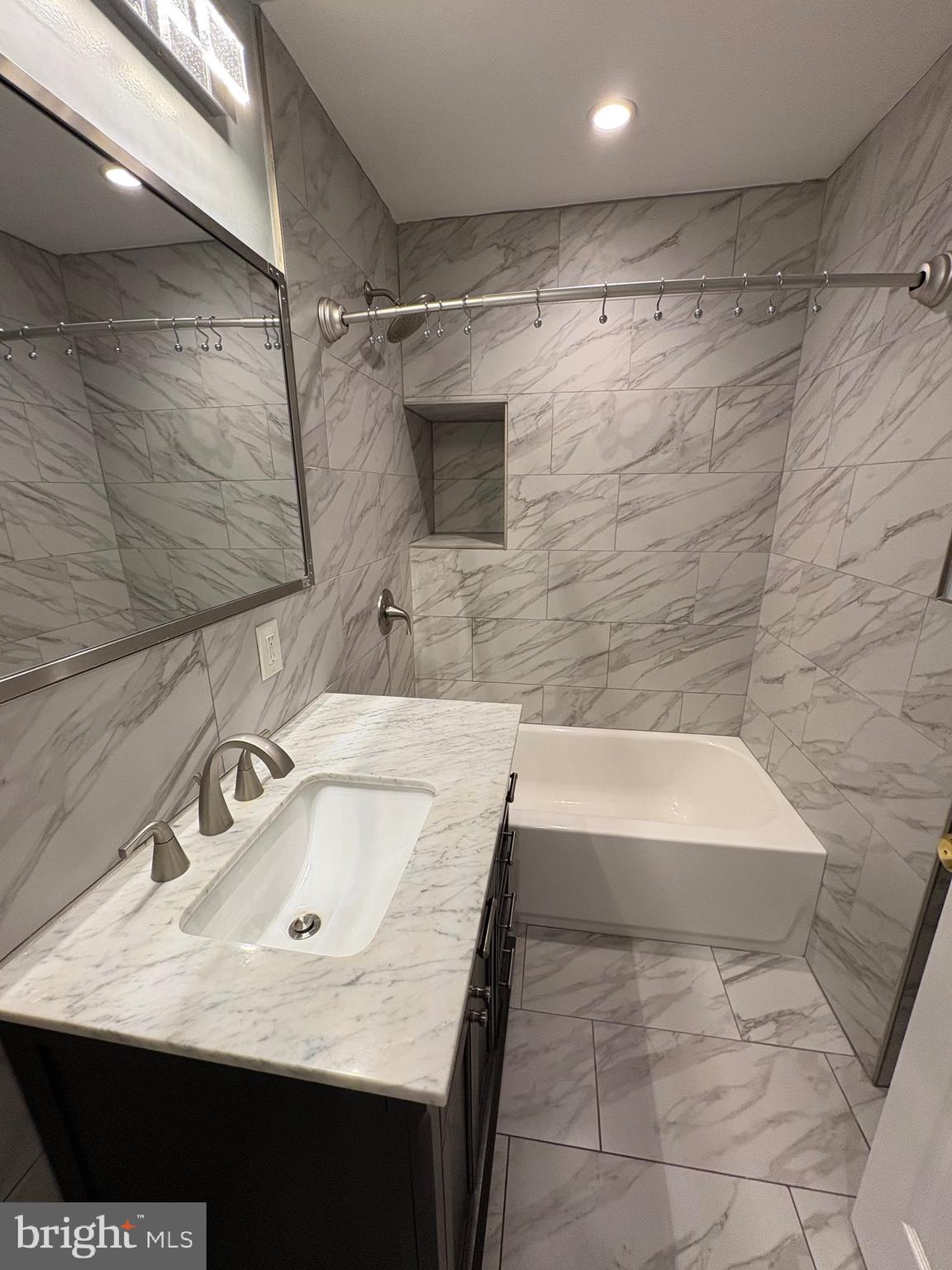 116 Grape Street, Unit 6 Philadelphia, PA 19127 - Photo 19 of 27 a bathroom with a sink and a bathtub