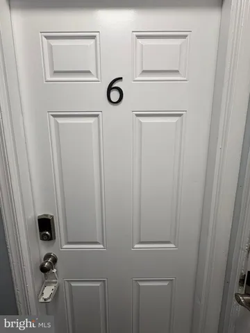 a bathroom with a shower and a sink