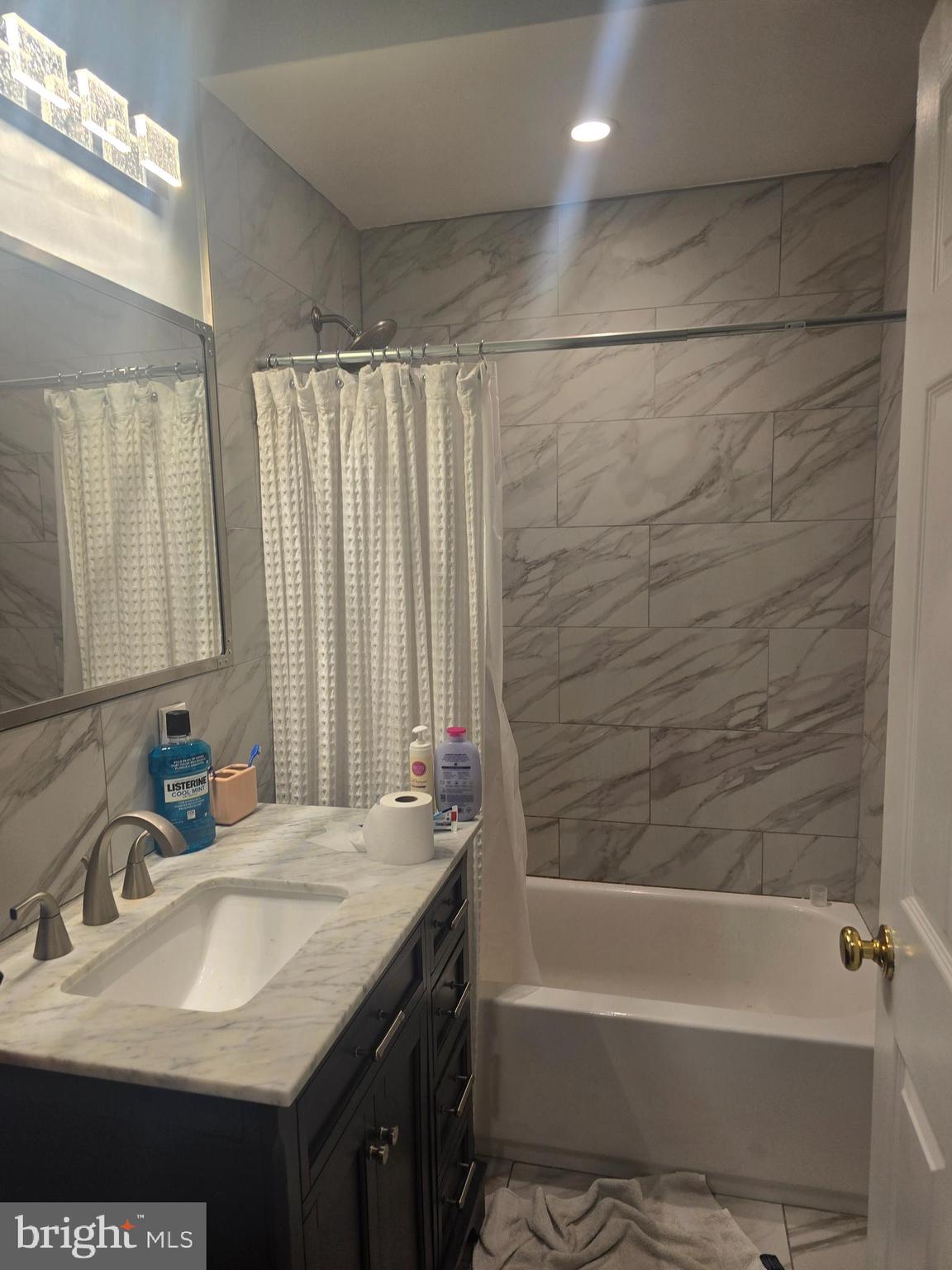 116 Grape Street, Unit 6 Philadelphia, PA 19127 - Photo 5 of 27 a bathroom with a sink and a mirror