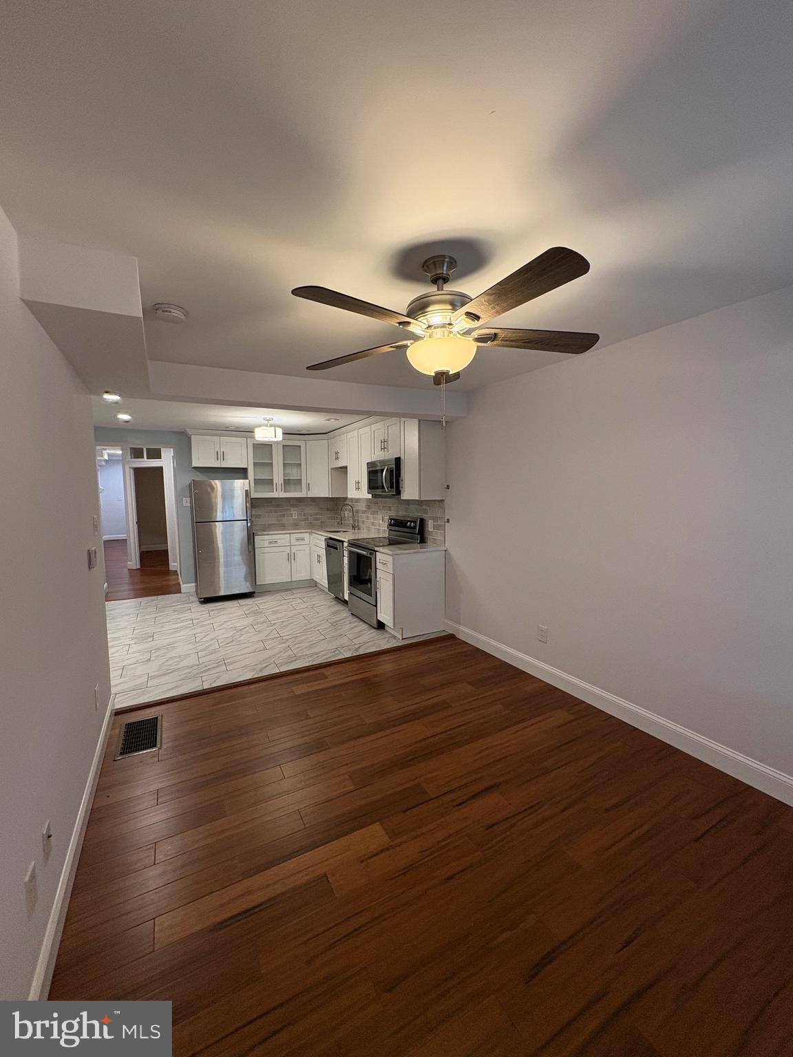 116 Grape Street, Unit 6 Philadelphia, PA 19127 - Photo 10 of 27 a view of kitchen with cabinets and wooden floor