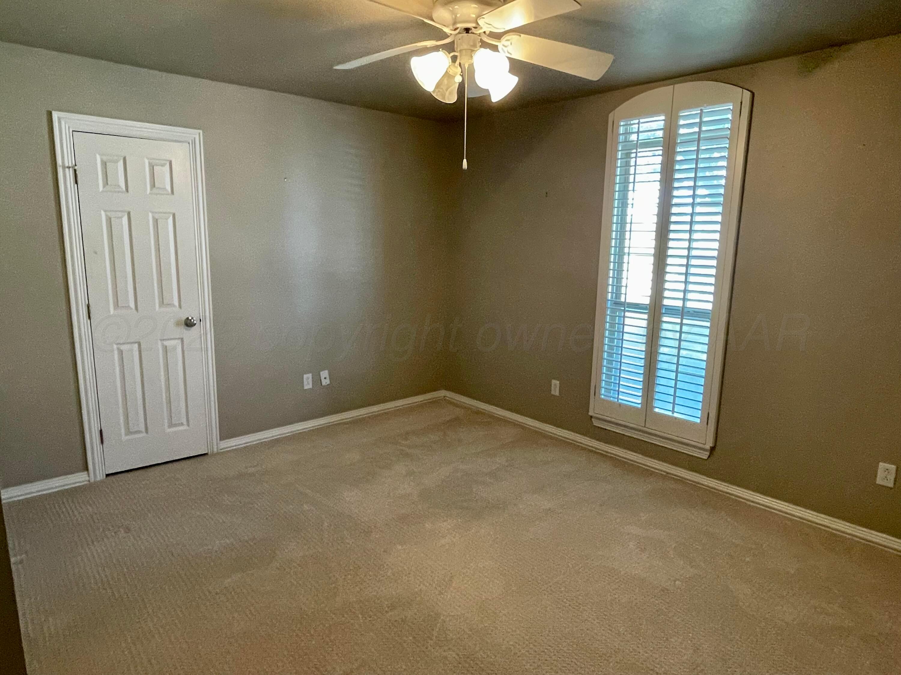 522 Carson Avenue Dumas, TX 79029 - Photo 16 of 18 a view of an empty room with a window
