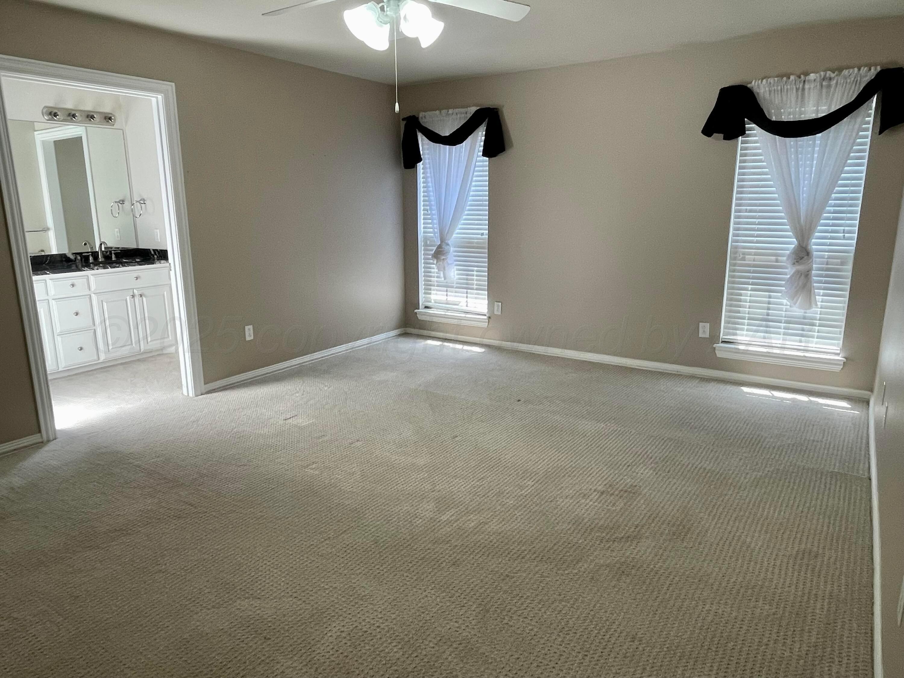 522 Carson Avenue Dumas, TX 79029 - Photo 10 of 18 a view of an empty room with a window
