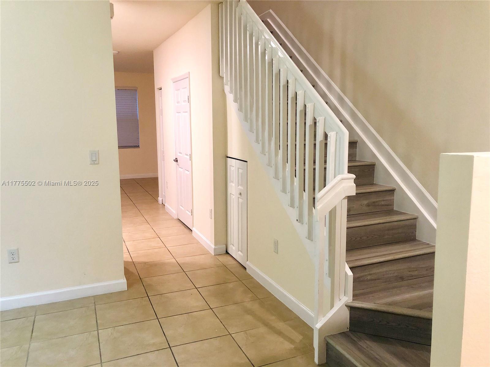 9213 West 33rd Way Hialeah, FL 33018 - Photo 6 of 13 a view of an entryway with staircase
