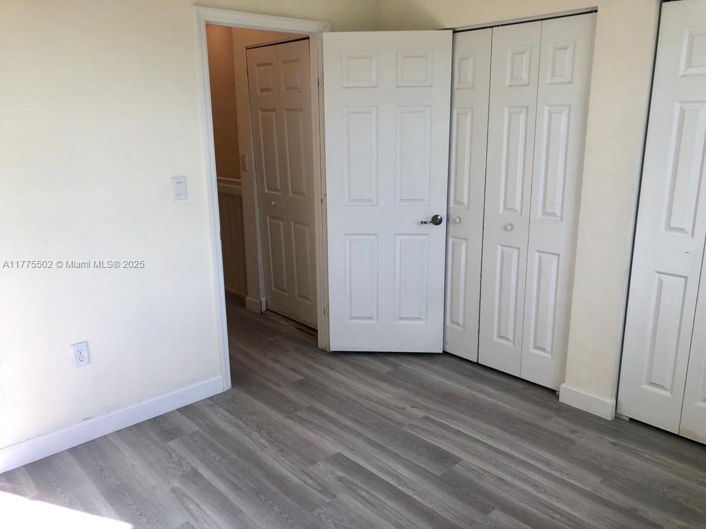 9213 West 33rd Way Hialeah, FL 33018 - Photo 8 of 13 a view of a livingroom with wooden floor