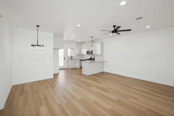 a view of kitchen with wooden floor and window