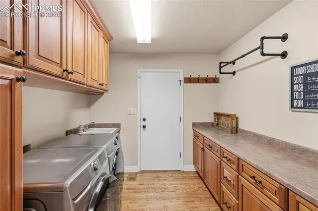 a bedroom with a large bed and wooden floor