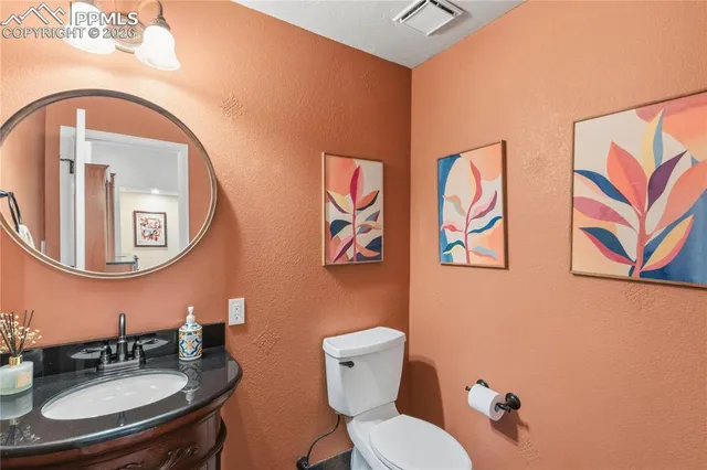 a spacious bedroom with a bed window and a flat screen tv