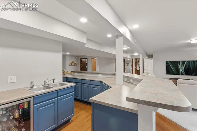 a view of a patio with table and chairs and wooden floor