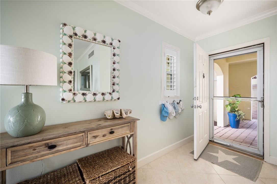 1180 Reef Road, Unit B7 Vero Beach, FL 32963 - Photo 3 of 28 a bathroom with a sink and a mirror