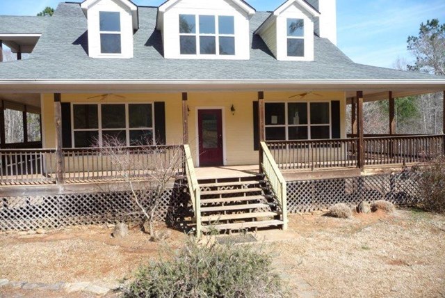 2998 Stokes Store Road Forsyth, GA 31029 - Photo 1 of 8 front view of a brick house with large windows