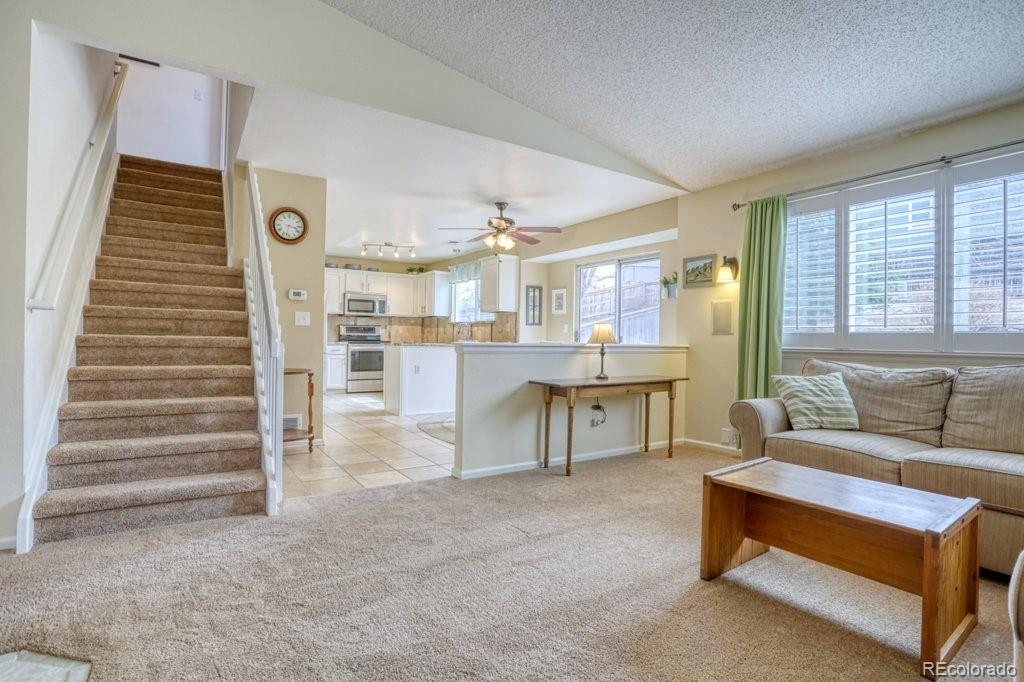 9561 South Castle Ridge Circle Highlands Ranch, CO 80129 - Photo 13 of 29 a living room with furniture and a table