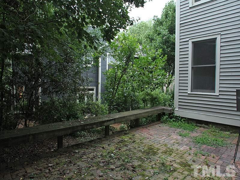 2109 Camrose Street Raleigh, NC 27608 - Photo 12 of 12 a view of a bench in a backyard