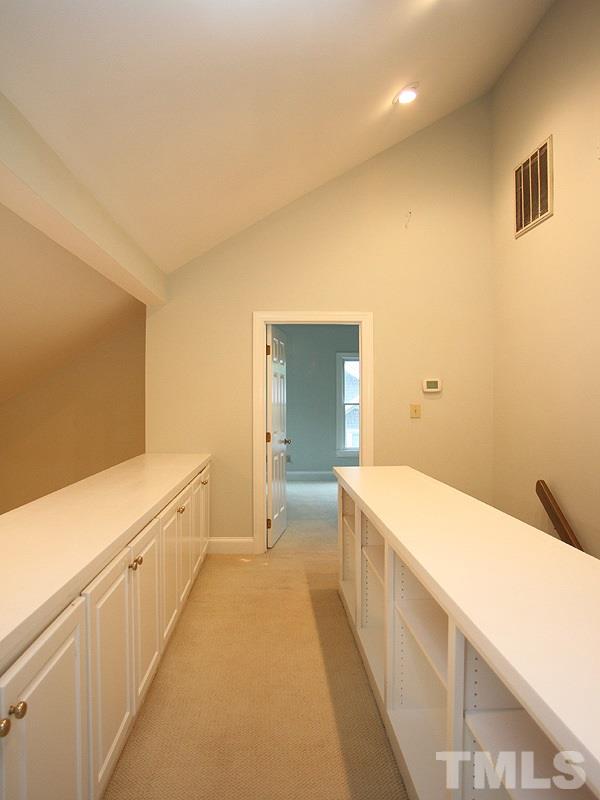 2109 Camrose Street Raleigh, NC 27608 - Photo 10 of 12 a bathroom with a sink a large mirror and a bathtub