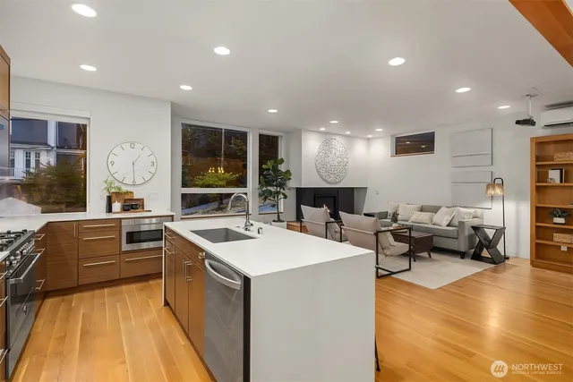 a kitchen with sink refrigerator and stove