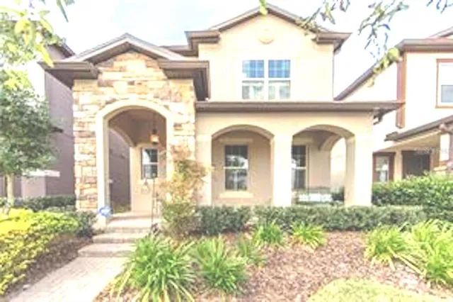 a view of two couches with a small yard