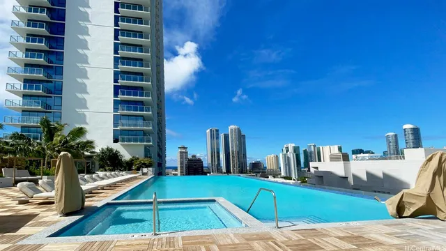 a view of a patio with couches and potted plants