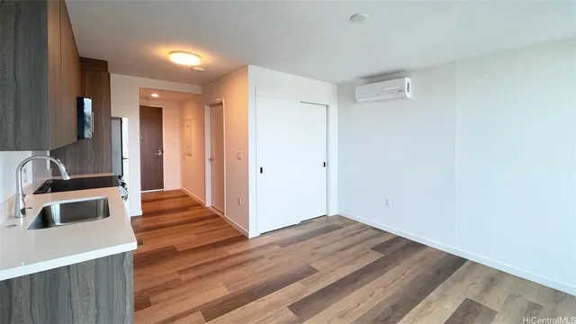 a view of a kitchen from the hallway