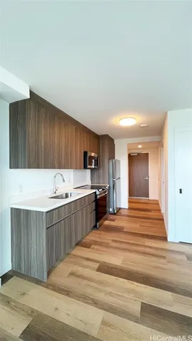 a kitchen with a sink and cabinets