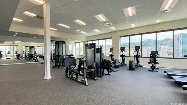 a lobby with furniture and floor to ceiling window