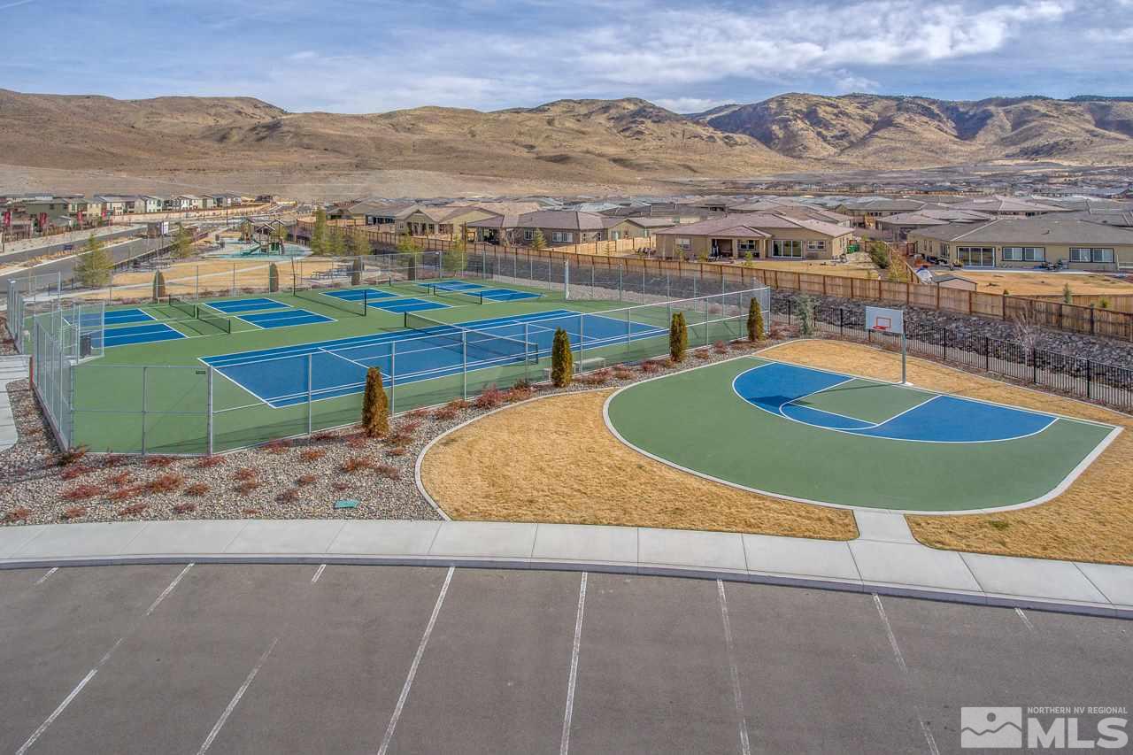 2930 Hasufel Way, Unit LOT #100 Reno, NV 89521 - Photo 19 of 19 an aerial view of a house with a swimming pool and mountain view
