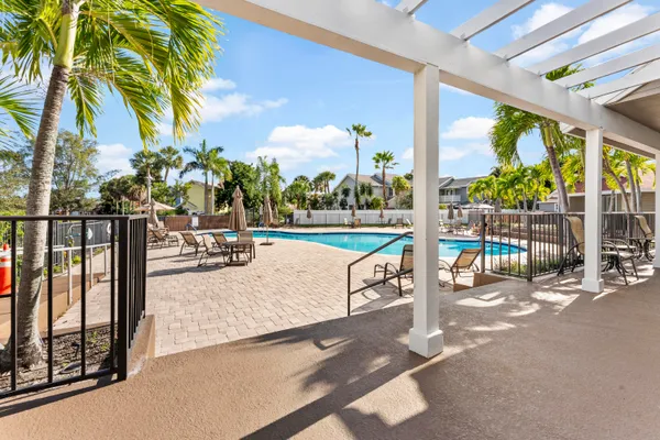a view of a swimming pool with a patio