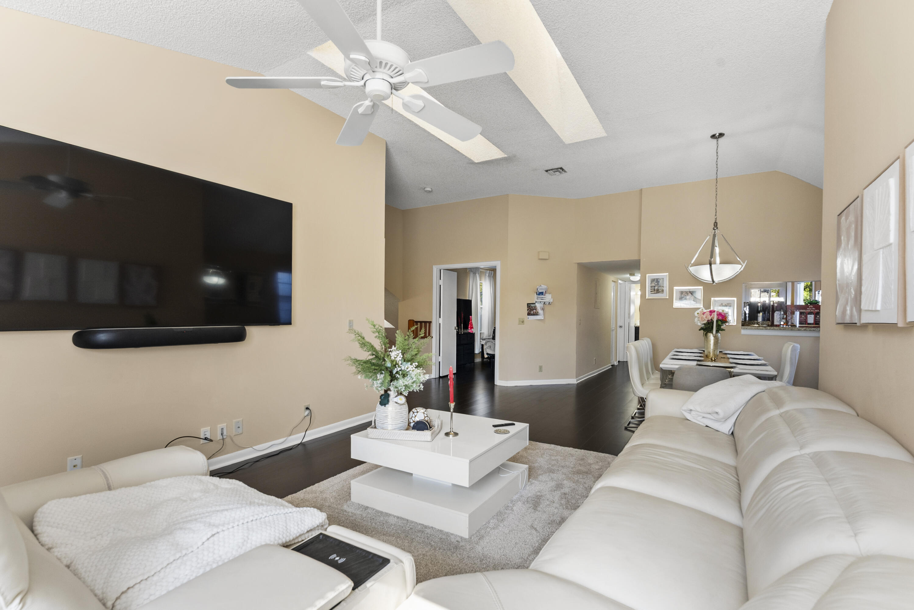 5359 Buckhead Circle, Unit 2031 Boca Raton, FL 33431 - Photo 4 of 25 a living room with furniture and a flat screen tv