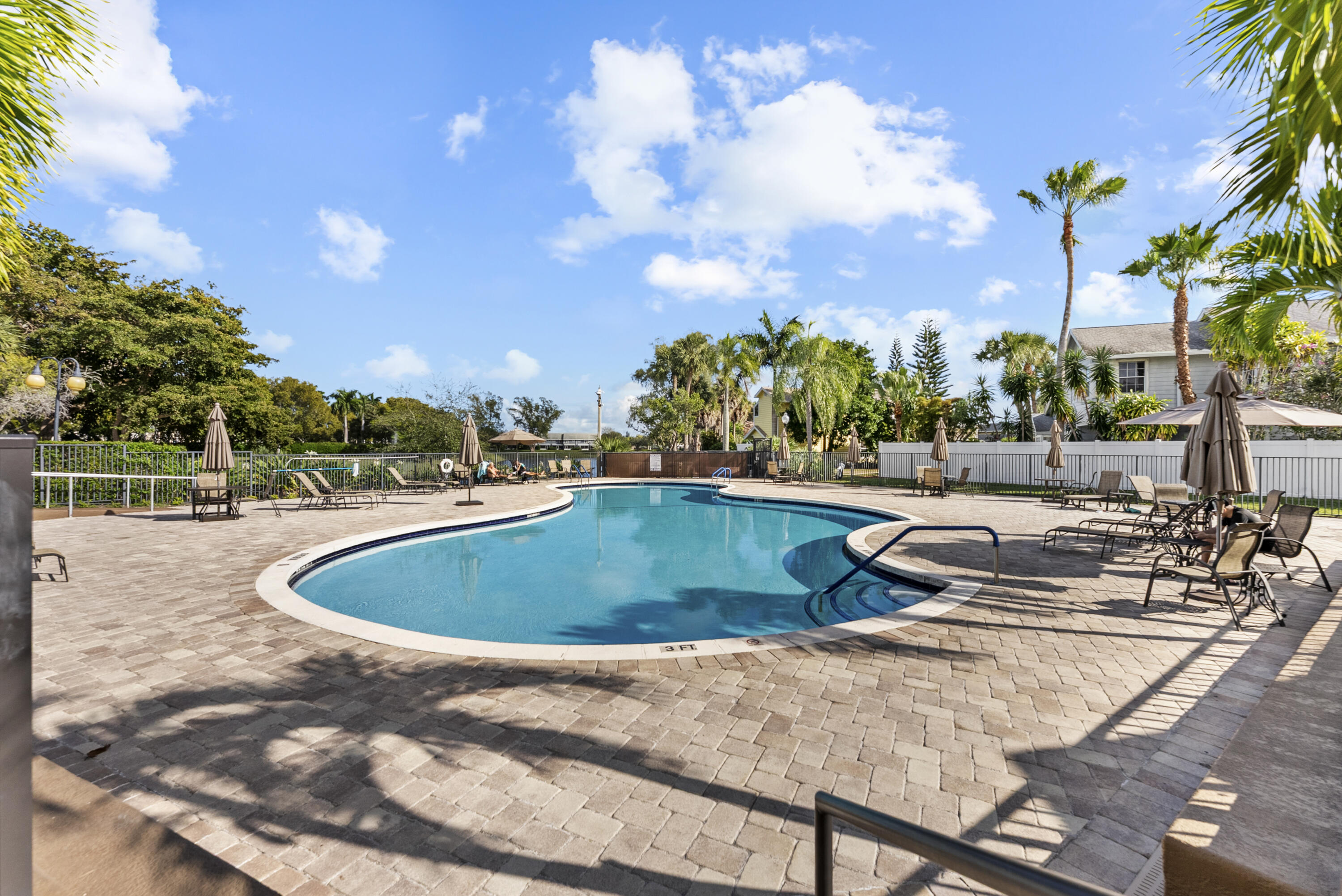 5359 Buckhead Circle, Unit 2031 Boca Raton, FL 33431 - Photo 7 of 25 a view of a swimming pool with a terrace