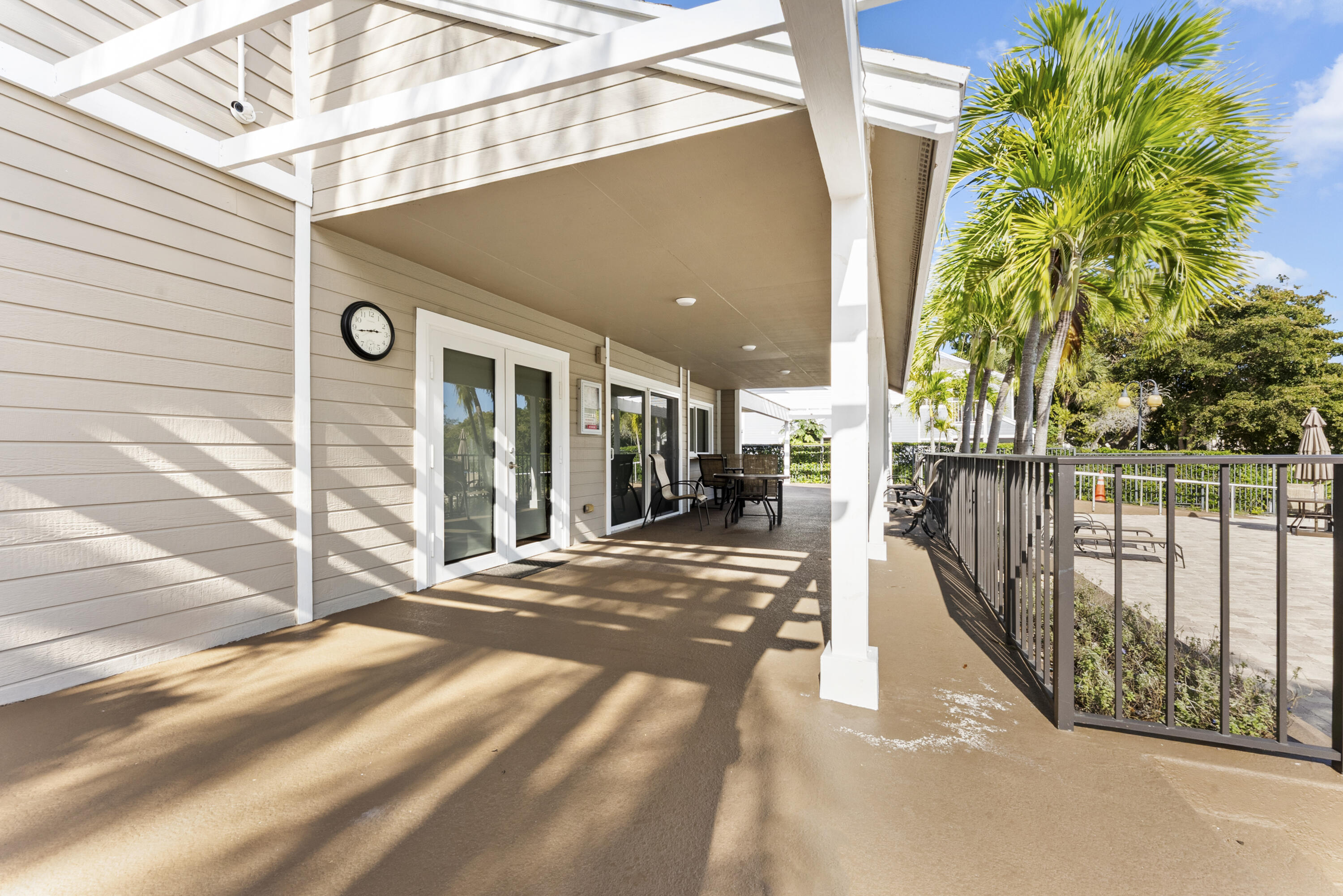 5359 Buckhead Circle, Unit 2031 Boca Raton, FL 33431 - Photo 8 of 25 a view of a porch with wooden floor and fence