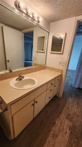 a bathroom with a sink double vanity granite and a mirror