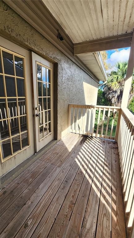 285 Wymore Road, Unit 207 Altamonte Springs, FL 32714 - Photo 16 of 17 a view of balcony with wooden floor