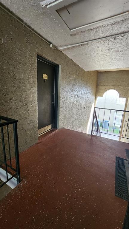 285 Wymore Road, Unit 207 Altamonte Springs, FL 32714 - Photo 2 of 17 a view of a livingroom with a staircase