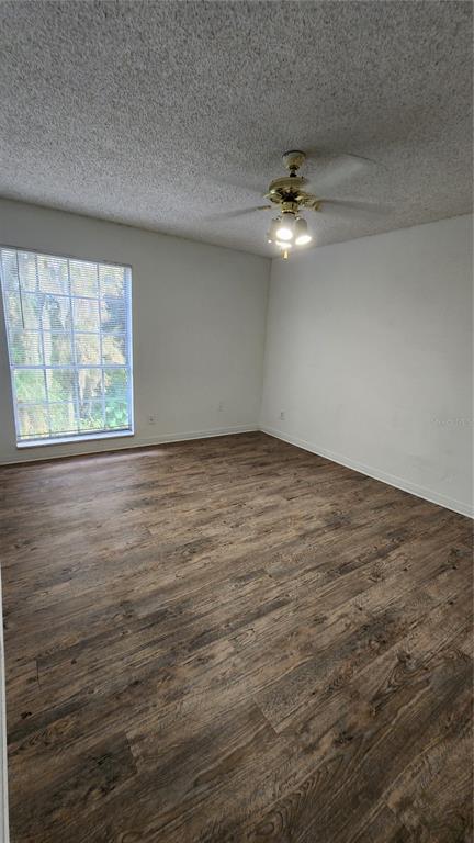 285 Wymore Road, Unit 207 Altamonte Springs, FL 32714 - Photo 10 of 17 an empty room with ceiling fan and window