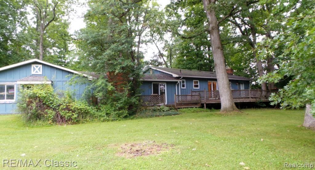2218 Lone Tree Road Highland, MI 48357 - Photo 2 of 25 Rear