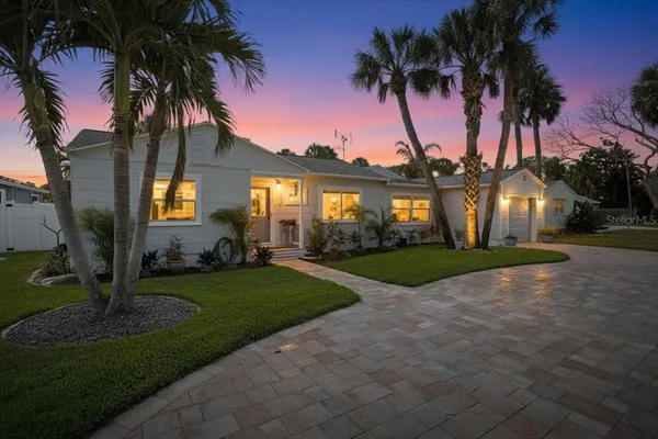 a kitchen with a sink stove and microwave